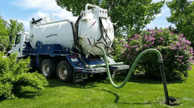 Professional vacuum truck performing residential drainage and septic maintenance in Oklahoma City, OK
